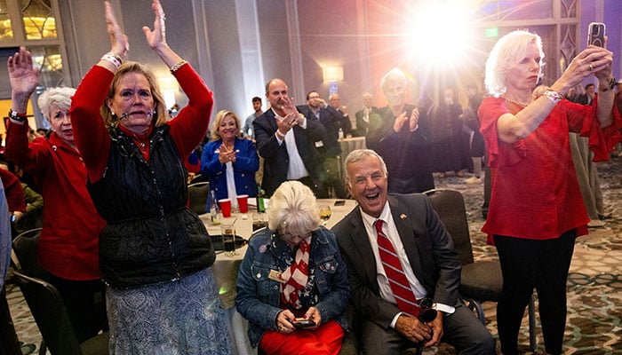 Supporters of Republican presidential nominee and former US President Donald Trump react as they watch early election results at a 2024 US Presidential Election Night Watch Party, in Atlanta, Georgia, US, November 6, 2024. — Reuters