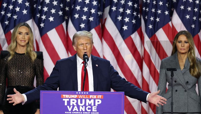 Republican presidential nominee and former US President Donald Trump is flanked by Melania Trump and Lara Trump as he addresses supporters, during the 2024 US Presidential Election, in Palm Beach County Convention Center, in West Palm Beach, Florida, US, November 6, 2024. — Reuters