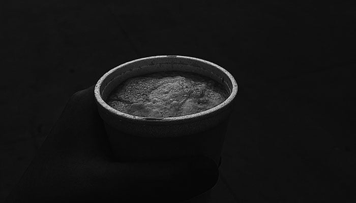 A black and white photograph of a cup of chai. — Photo by author