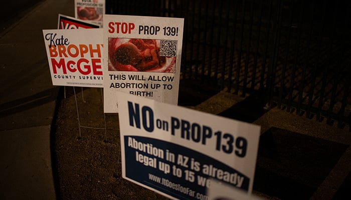 Anti-abortion campaign signs are posted outside the voting center at Osborn Elementary School District Office, on Election Day, in Phoenix, Arizona, US, November 5, 2024. — Reuters