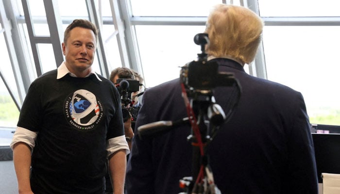 Donald Trump and Elon Musk are seen at the Firing Room Four after the launch of a SpaceX Falcon 9 rocket and Crew Dragon spacecraft on NASAs SpaceX Demo-2 mission to the International Space Station from NASAs Kennedy Space Center in Cape Canaveral, Florida, US on May 30, 2020. — Reuters