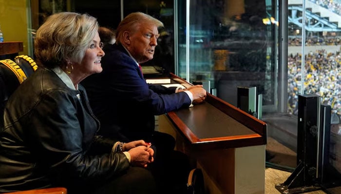 Republican presidential nominee former President Donald Trump sits with Susie Wiles as he attends the New York Jets football game against the Pittsburgh Steelers at Acrisure Stadium, Sunday, on Oct. 20, 2024, in Pittsburgh. — Reuters