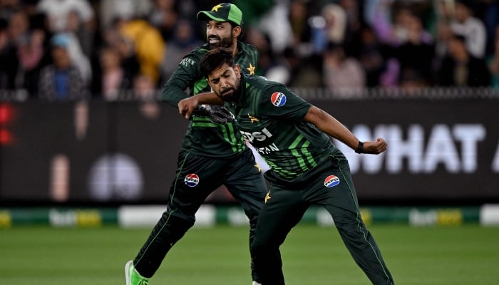 Bowler Haris Rauf (right) celebrates with Mohammad Rizwan after dismissing Australian batsman Glenn Maxwell during the first ODI between Australia and Pakistan at the Melbourne Cricket Ground (MCG) in Melbourne on November 4, 2024. — AFP