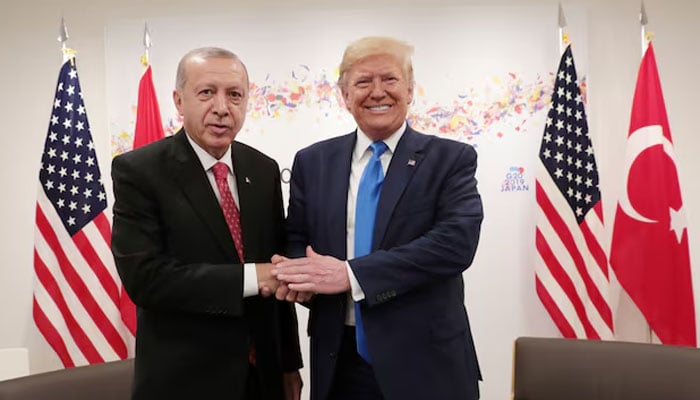 Turkiyes President Tayyip Erdogan shakes hands with US President-elect Donald Trump during their bilateral meeting on the sidelines of the G20 leaders summit in Osaka, Japan, June 29, 2019. — Reuters