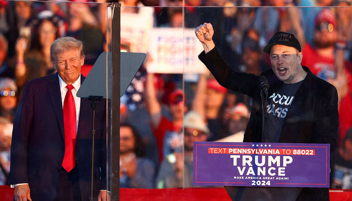 Tesla CEO and X owner Elon Musk speaks as Republican presidential nominee and US President-elect Donald Trump looks on during a rally at the site of the July assassination attempt against Trump, in Butler, Pennsylvania, US, October 5, 2024. — Reuters