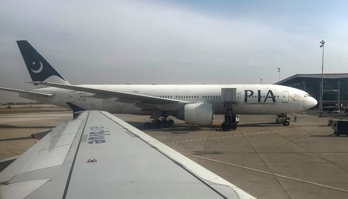 Pakistan International Airlines (PIA) passenger plane sits on tarmac, as seen through a plane window, at the Islamabad International Airport, Islamabad, on October 27, 2024. —Reuters