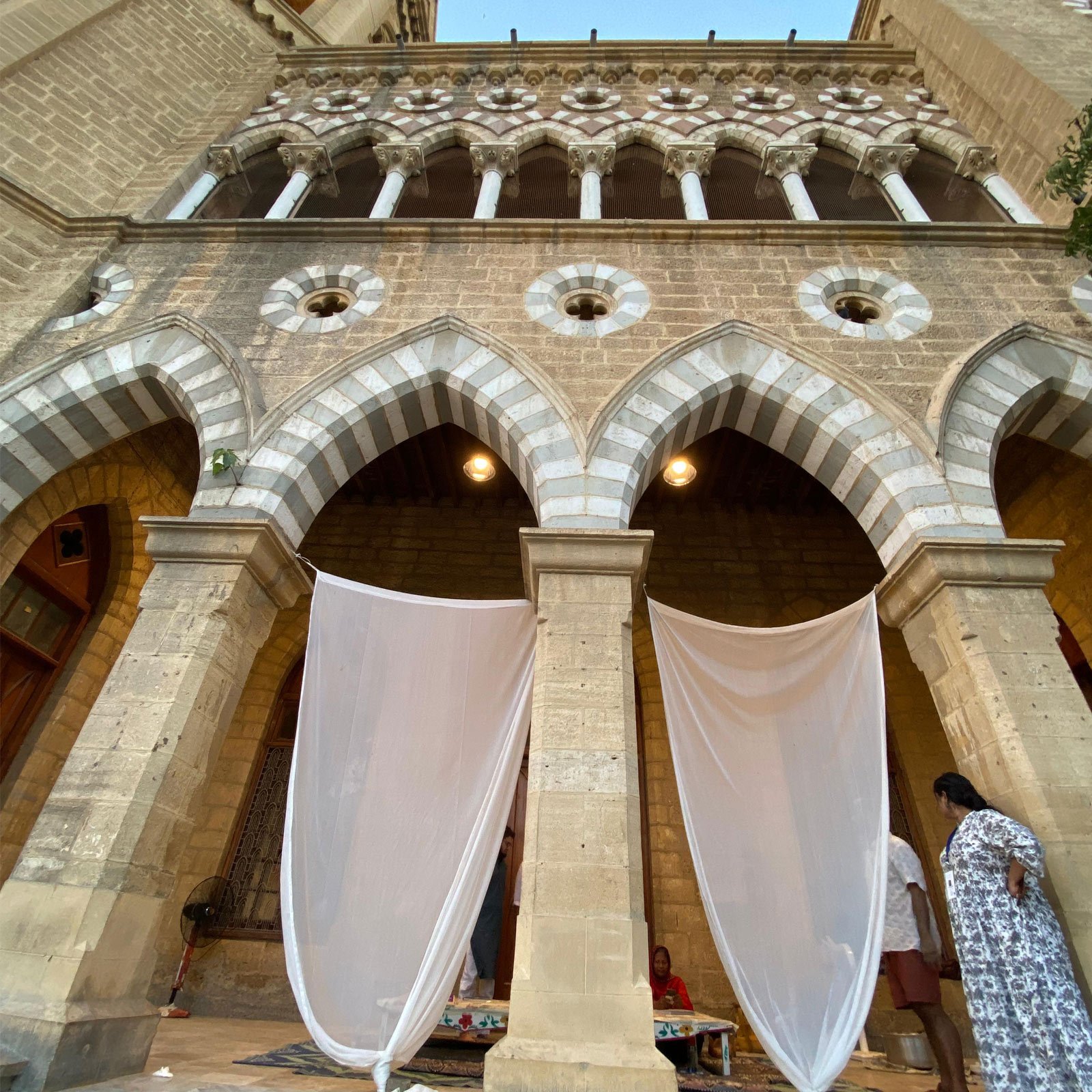 Fatima Majeed seen sitting on The Table — a project space  behind the curtains at Biennale 2024. — Reporter