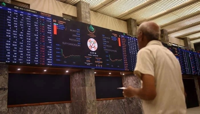 A stockbroker monitors the share prices during a trading session at the Pakistan Stock Exchange in Karachi on May 16, 2022. — AFP