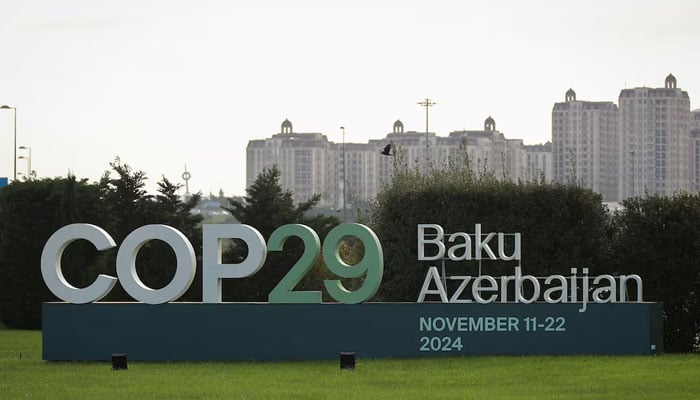 A view shows a sign of the COP29 United Nations Climate Change Conference with a backdrop of the city scape in Baku, Azerbaijan, October 31, 2024. — Reuters