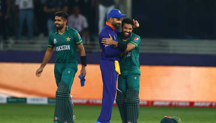 Virat Kohli congratulates Babar Azam and Mohammad Rizwan after the T20 World Cup 2021 match, Dubai, October 24, 2024. — AFP