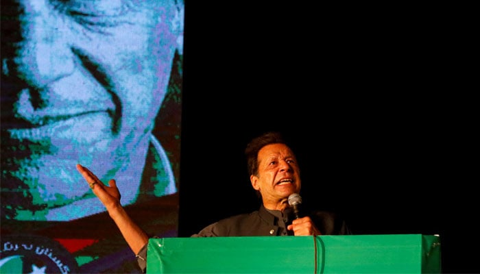 Former prime minister Imran Khan gestures as he addresses supporters during a rally in Karachi, April 16, 2022. — Reuters