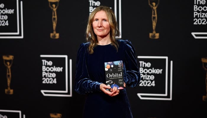 British writer Samantha Harvey and Booker Prize 2024 winner for her book Orbital poses on the red carpet upon arrival for the Booker Prize Award announcement ceremony, at the Old Billingsgate, in London, on November 12, 2024. — AFP