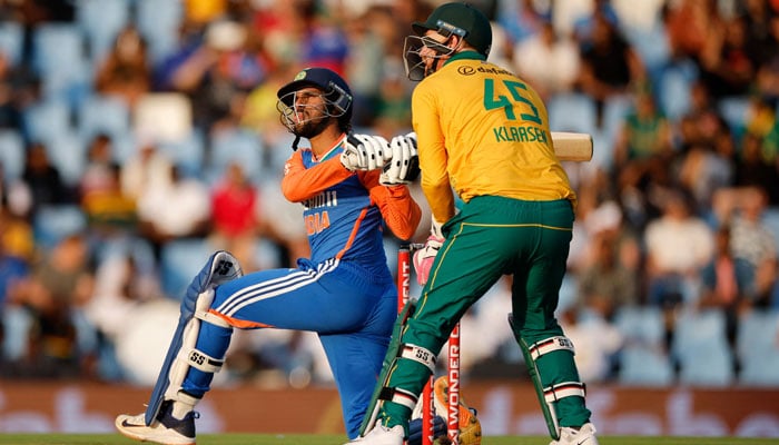 India´s Tilak Varma (left) reacts hitting a six as South Africa´s wicketkeeper Heinrich Klaasen (right) reacts during the third T20 international cricket match between South Africa and India at SuperSport Park in Centurion on November 12, 2024. — AFP