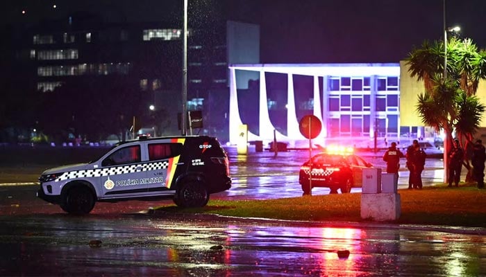 Police vehicles are seen in front of the Brazilian Supreme Court after explosions in the Three Powers Square in the capital Brasilia, Brazil on November 13, 2024. — Reuters