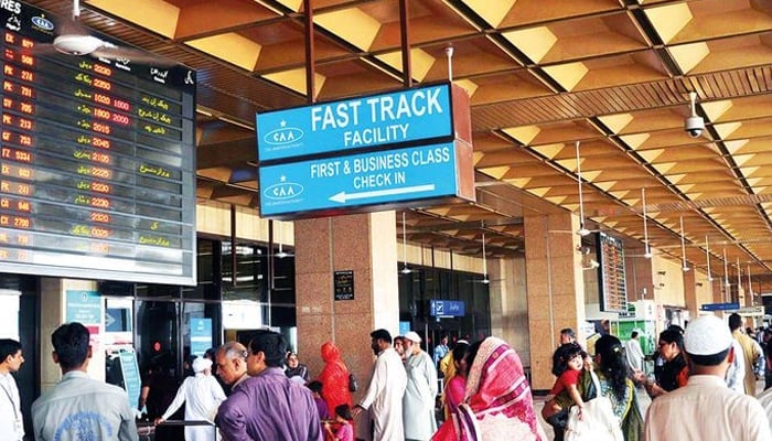 An undated image of people standing at the Jinnah International Airport in Karachi. — AFP/File