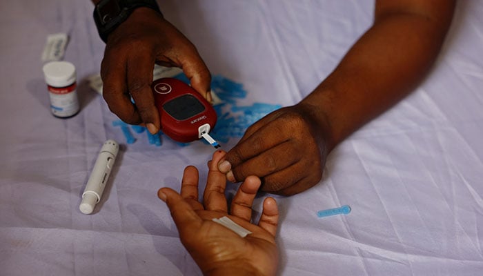 A person receives a free blood sugar test during a campaign to mark the World Diabetes Day in Dhaka, Bangladesh, November 14, 2024. — Reuters