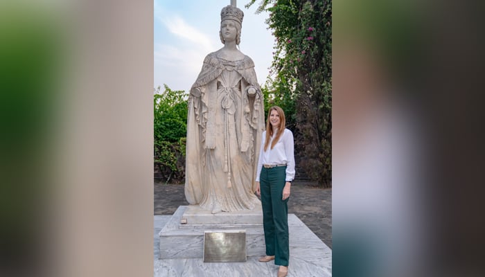 UK envoy to Pakistan Jane Marriott poses alongside a statue. — British High Commission