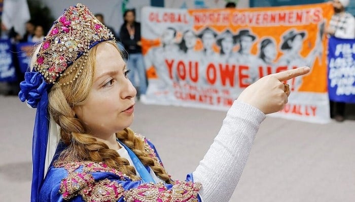 A woman dressed in traditional clothing attends a protest during the United Nations COP29, in Baku, Azerbaijan November 14, 2024. — Reuters