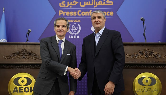 IAEA Director General Rafael Mariano Grossi shakes hands with Head of Irans Atomic Energy Organization Mohammad Eslami during a press conference in Tehran, Iran, November 14, 2024. — Reuters