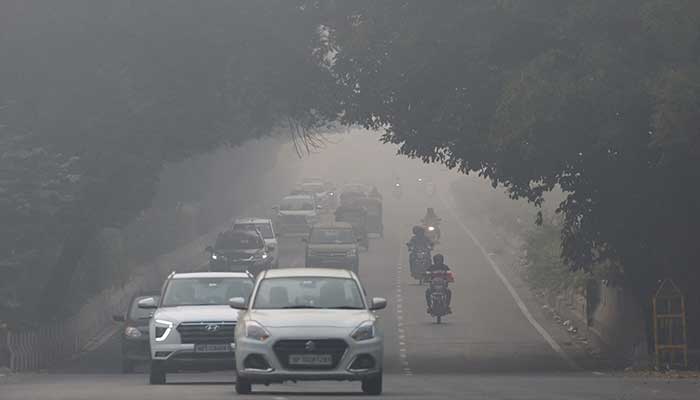 Traffic passes by on a road as the sky is enveloped with smog after Delhis air quality was classified as hazardous amidst severe air pollution, in New Delhi, India, November 14, 2024. — Reuters