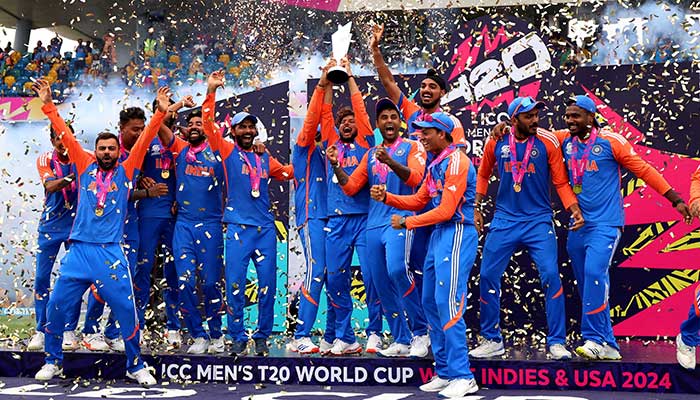 Indias Kuldeep Yadav lifts the T20 World Cup trophy as they celebrate after winning the final against South Africa at Kensington Oval, Bridgetown, Barbados, June 29, 2024. — Reuters