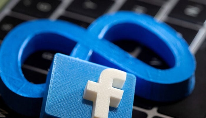 3D printed Meta and Facebook logos are placed on a laptop keyboard in this illustration. — Reuters