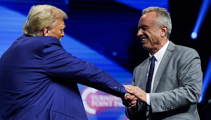 Robert F Kennedy Jr and President-elect Donald Trump greet each other at a campaign event sponsored by conservative group Turning Point USA, in Duluth, Georgia, US, October 23, 2024. — Reuters