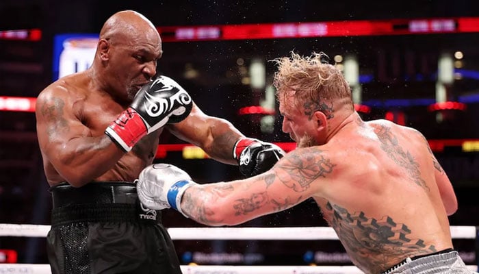 Jake Paul (right) and Mike Tyson fight in Arlington, Texas, on November 15, 2024. —AFP