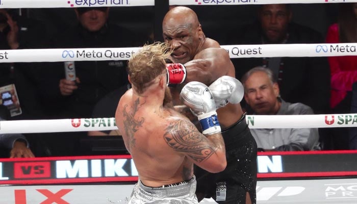 Boxing legend Mike Tyson (black gloves) fights Jake Paul (silver gloves) at AT and T Stadium in Arlington, Texas, US on November 15, 2024. — Reuters