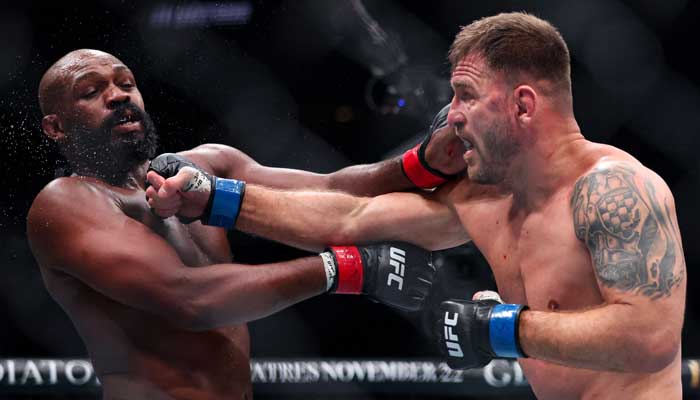 Stipe Miocic (right) and Jon Jones trade punches in the UFC light heavyweight championship fight during the UFC 309 event at Madison Square Garden, New York, US on November 17, 2024. — AFP