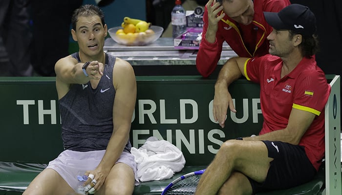 Spains Rafael Nadal and coach Carlos Moya talks during a practice session, Davis Cup Finals, Malaga, Spain November 16, 2024. — Reuters