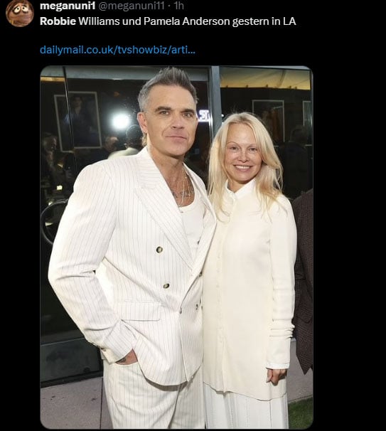 Robbie William poses with Pamela Anderson (Source: X)