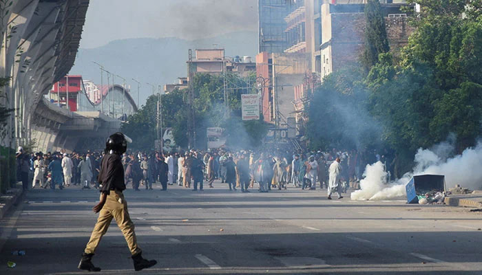 Pakistan Tehreek-e-Insaf supporters gather for a rally as tear gas is used by police officers to disperse them, in Rawalpindi, September 28, 2024. — Reuters