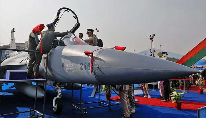 Officials inspect the cockpit of a JF17 Thunder fighter jet during the International Defence Exhibition and Seminar IDEAS 2022 in Karachi on November 16, 2022. — Reuters