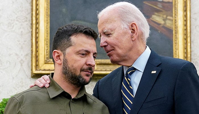 Ukrainian President Volodymyr Zelenskiy is embraced by US President Joe Biden in the Oval Office of the White House in Washington, September 21, 2023.  —Reuters