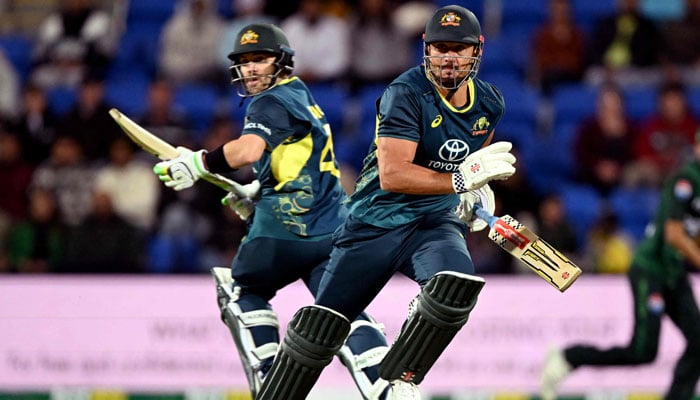 Australian batsmen Josh Inglis (left) and Marcus Stoinis (right) take a quick single during the third Twenty20 international cricket match between Australia and Pakistan at Bellerive Oval in Hobart on November 18, 2024. – AFP