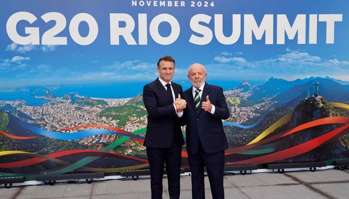 Brazil´s President Luiz Inacio Lula da Silva (R) poses for a picture with France´s President Emmanuel Macron upon his arrival for the first day of the G20 Summit in Rio de Janeiro, Brazil, on November 18, 2024. — AFP