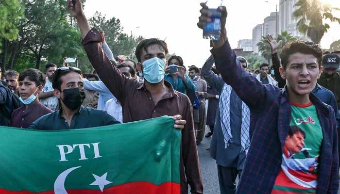 PTI supporters and activists shout slogans during a protest in Islamabad on October 4, 2024. — AFP