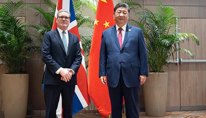 Britains PM Keir Starmer (L) poses for a photograph with Chinas President Xi Jinping, during their bilateral meeting at the Sheraton Hotel, on the sidelines of G20 summit in Rio de Janeiro, Brazil on November 18, 2024. — AFP