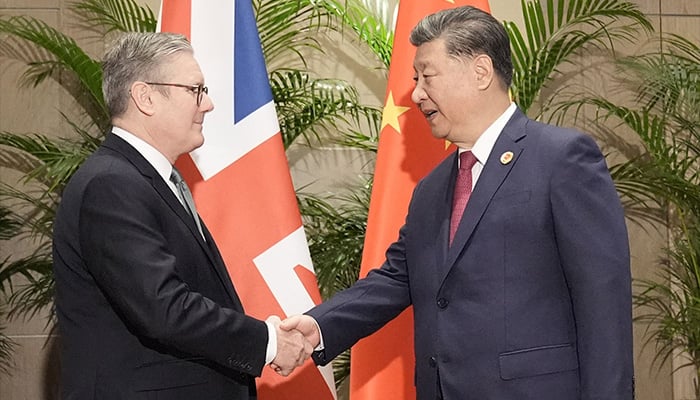 Britains Prime Minister Keir Starmer (L) shakes hands with Chinas President Xi Jinping, ahead of their bilateral meeting at the Sheraton Hotel, on the sidelines of G20 summit in Rio de Janeiro, Brazil on November 18, 2024. — AFP