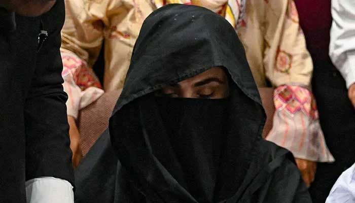 Bushra Bibi, the wife of PTI founder Imran Khan, is seen seated at a registrar office in the Lahore High Court on July 17, 2023. — AFP