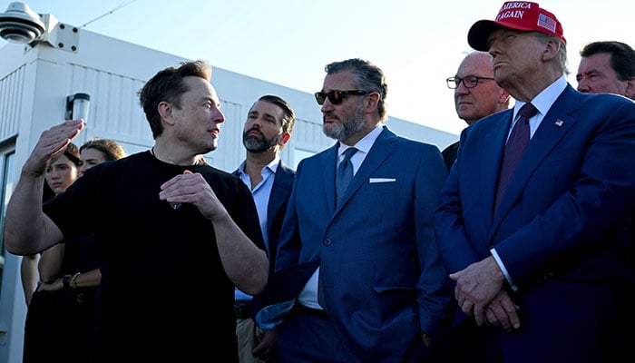 Elon Musk speaks with US President-elect Donald Trump and guests including Donald Trump Jr., Sen. Ted Cruz (R-TX) and Kevin Cramer (R-ND) at a viewing of the launch of the sixth test flight of the SpaceX Starship, in Brownsville, Texas, November 19, 2024. — Reuters