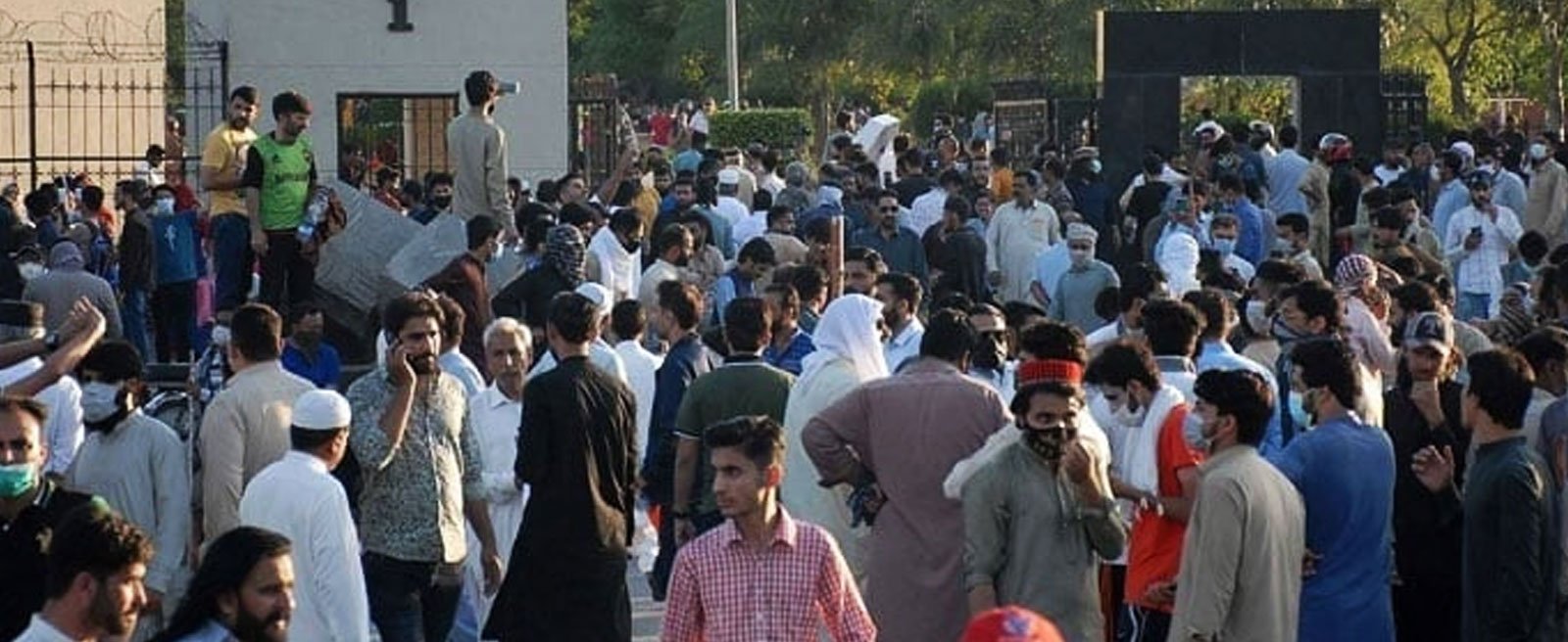 Charged mob gathers in front of the main entrance of General Headquarters (GHQ) during a protest against the arrest of PTI founder Imran Khan, in Rawalpindi on May 9, 2023. — AFP