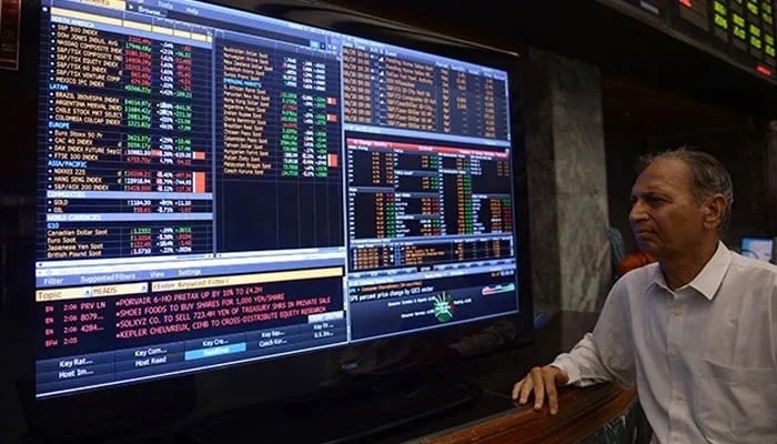 A trader monitors electronic trading board on the floor of Pakistan Stock Exchange. — Reuters/File