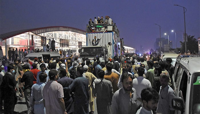 PTI activists shouting slogans during a protest in favour of their demands as they reached Islamabad from Peshawar at Jinnah Avenue, Islamabad. — Online/File