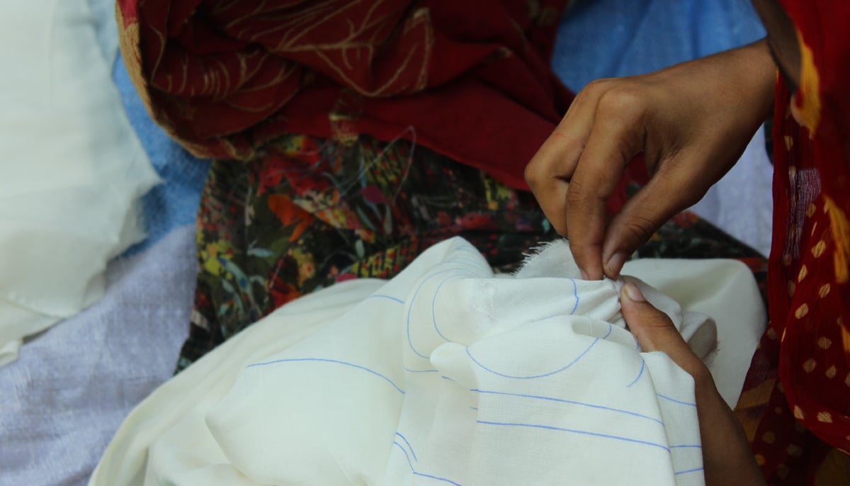 An artisan creates the chunari affect using threads on a fabric. — Photo by author