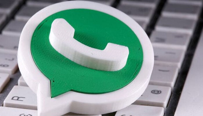 A 3D-printed WhatsApp logo is placed on the keyboard in this illustration taken on April 12, 2020. — Reuters