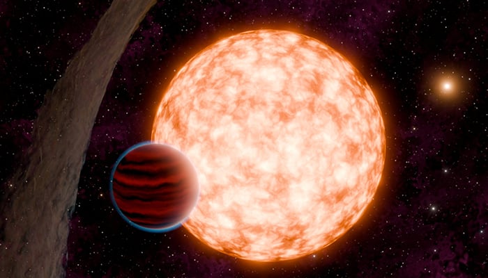 An artists depiction of a planet and its host star with a misaligned disk of material, and a binary companion in the background, is shown in this undated handout image. — Reuters/file