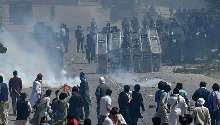 PTI activists and supporters of former prime minister Imran Khan clash with policemen during a protest against the arrest of their leader, in Islamabad. — AFP/File