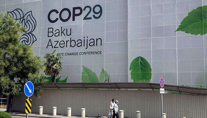 Branding for the COP29 climate conference covers the facade of a building under renovation in Baku, Azerbaijan. — AFP/File